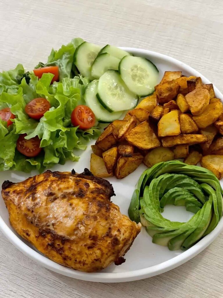 Spiced Chicken Breast with Crispy Potatoes and Avocado Rose