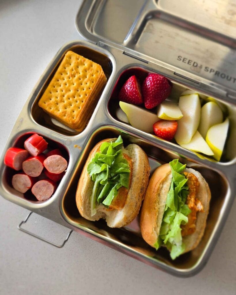 Stainless Steel Bento with Mini Subs and Sliced Fruit